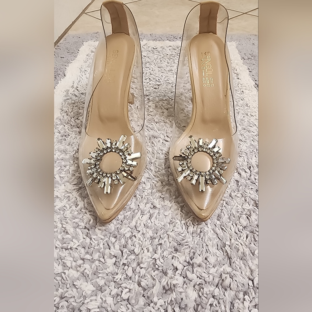 Nude Heel With Clear Stone Emblishment At The Toe.